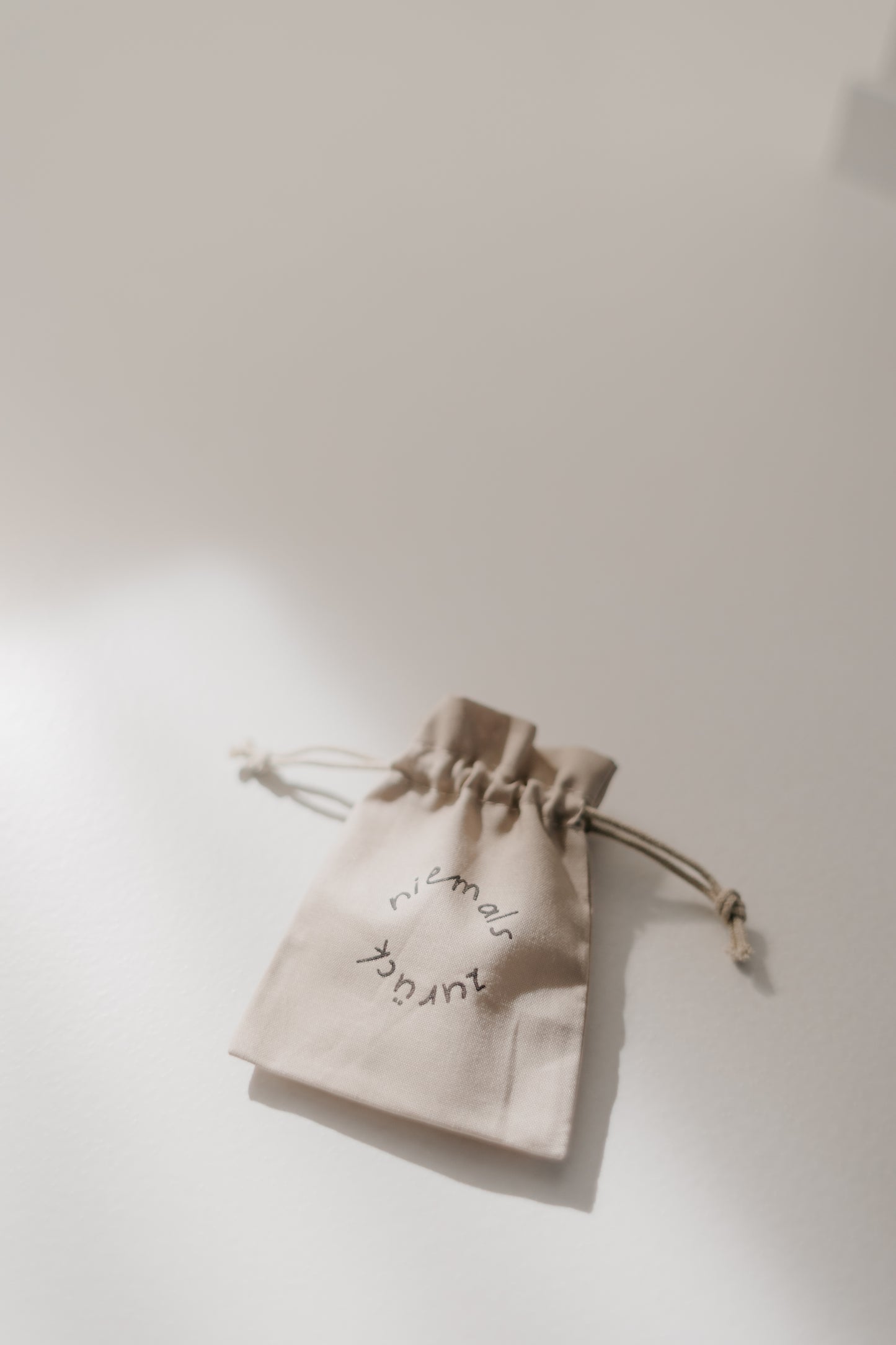 Niemals zurück - Armband mit Karte & Stoffbeutel